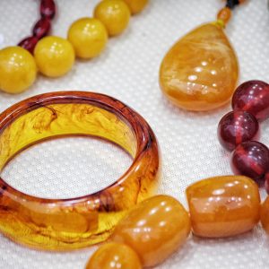 Jewelry shop with amber necklace and precious bracelet and pendant